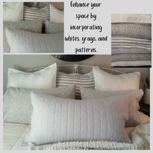 Arrangement of vibrant pillowcases in shades of whites and grays.